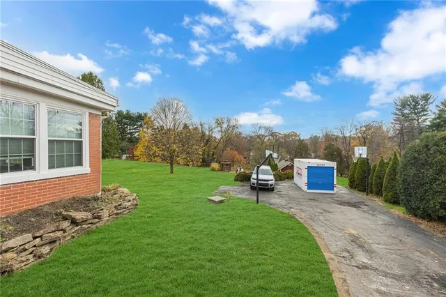 a view of a house with backyard porch and garden