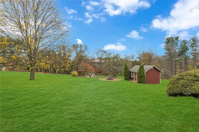 a view of a big yard in front of the house