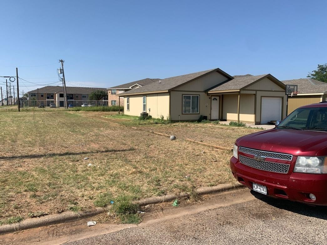 1520 East 28th Street Lubbock, TX 79404 - Photo 3 of 3 a front view of a house with a yard