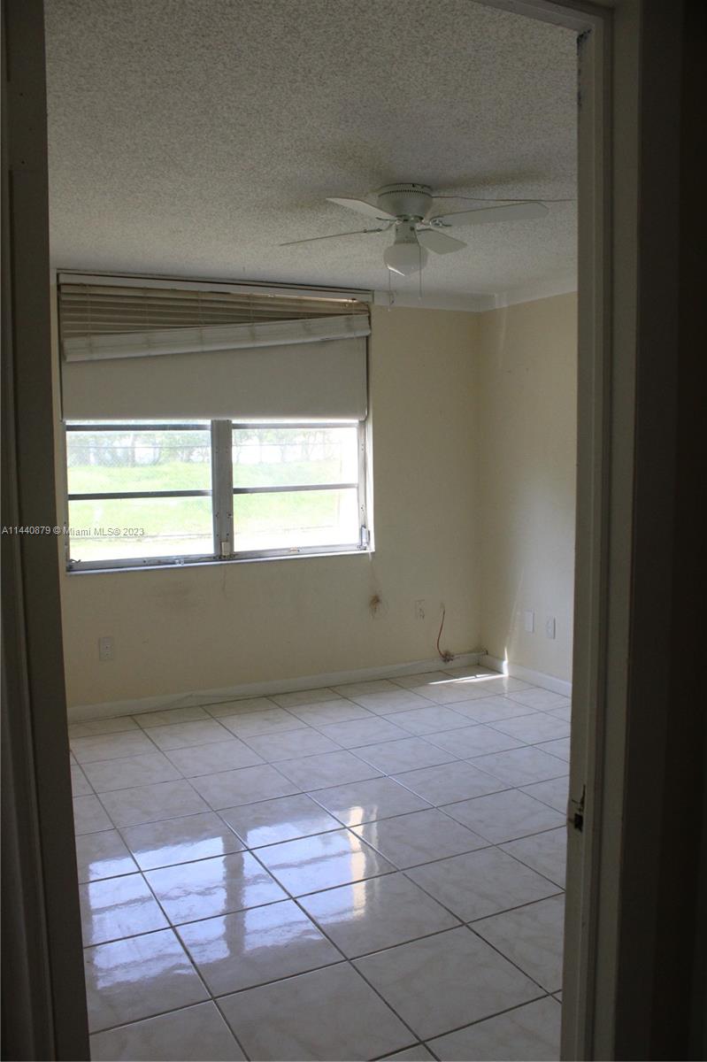 3490 Foxcroft Road, Unit B110 Miramar, FL 33025 - Photo 1 of 39 a view of an empty room with a window