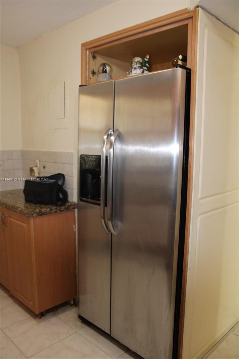3490 Foxcroft Road, Unit B110 Miramar, FL 33025 - Photo 11 of 39 a close view of a refrigerator in kitchen