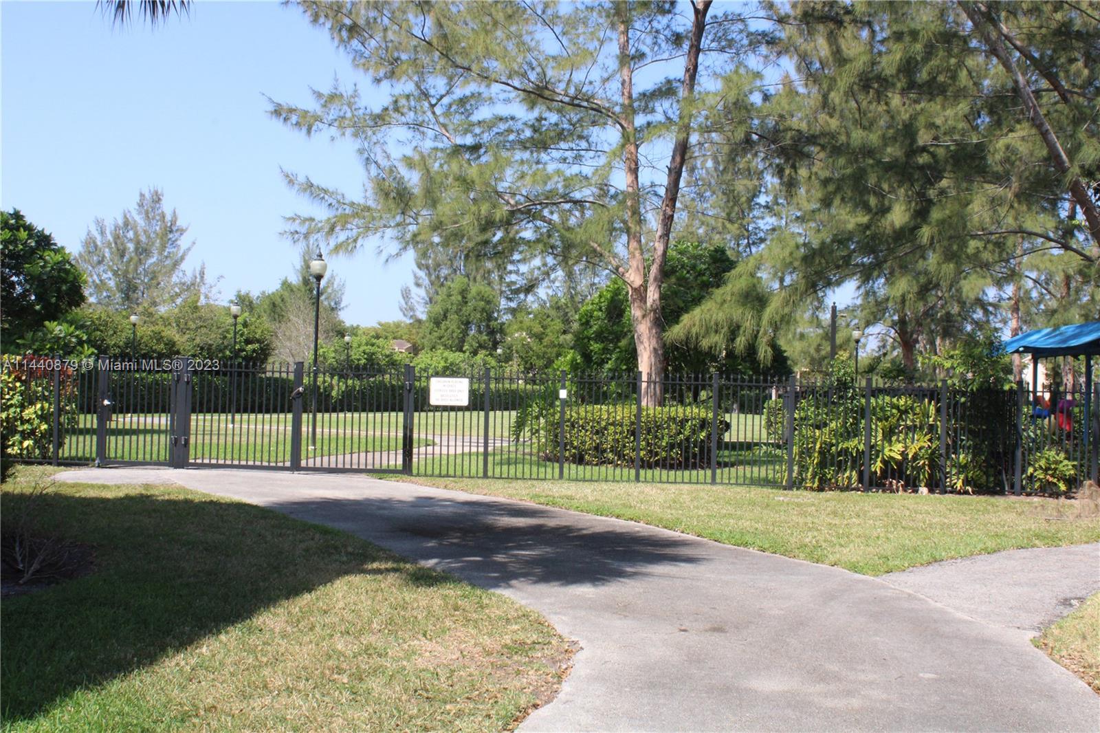 3490 Foxcroft Road, Unit B110 Miramar, FL 33025 - Photo 24 of 39 a view of a house with a big yard