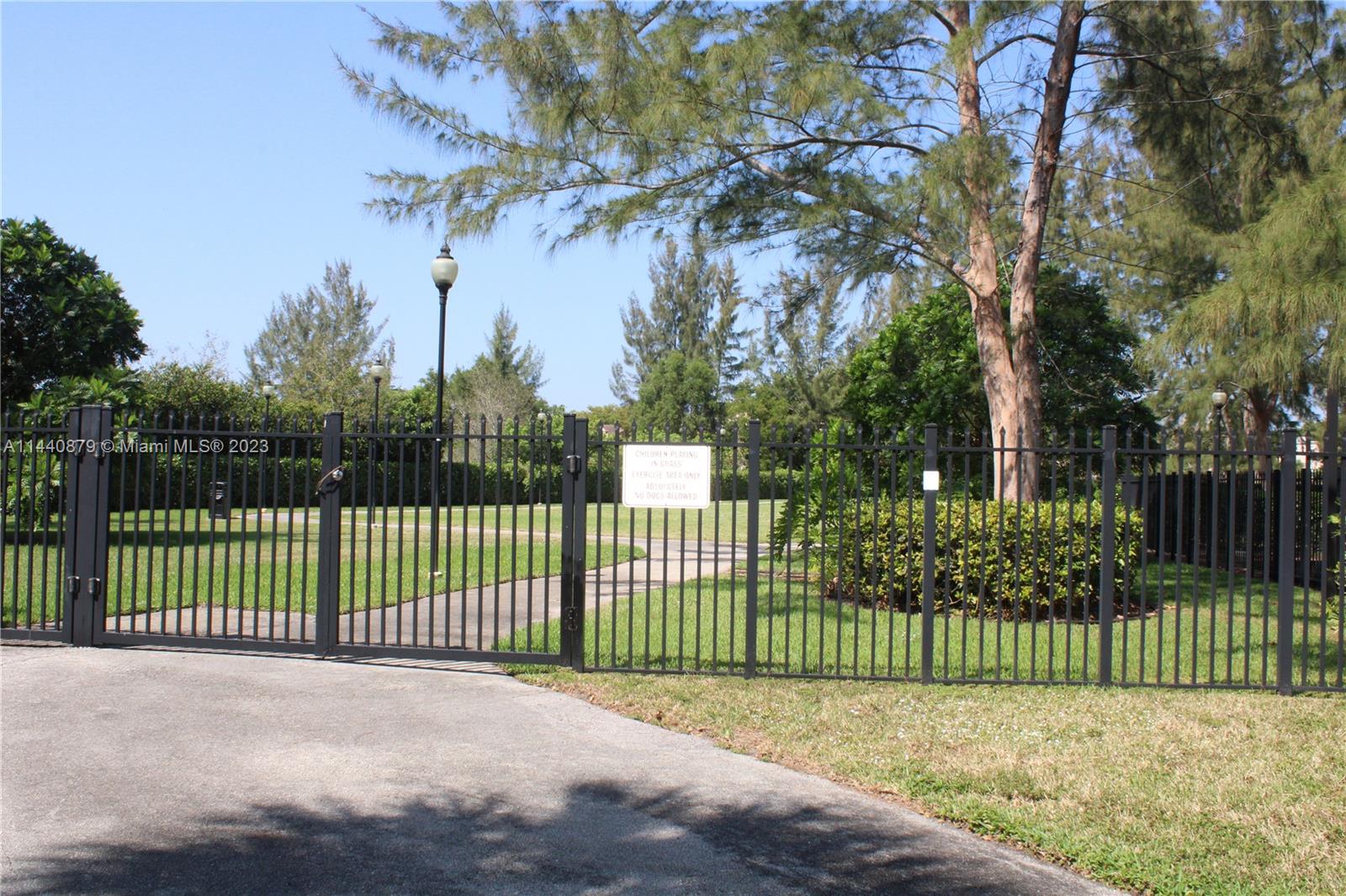 3490 Foxcroft Road, Unit B110 Miramar, FL 33025 - Photo 25 of 39 a view of a backyard with a fence