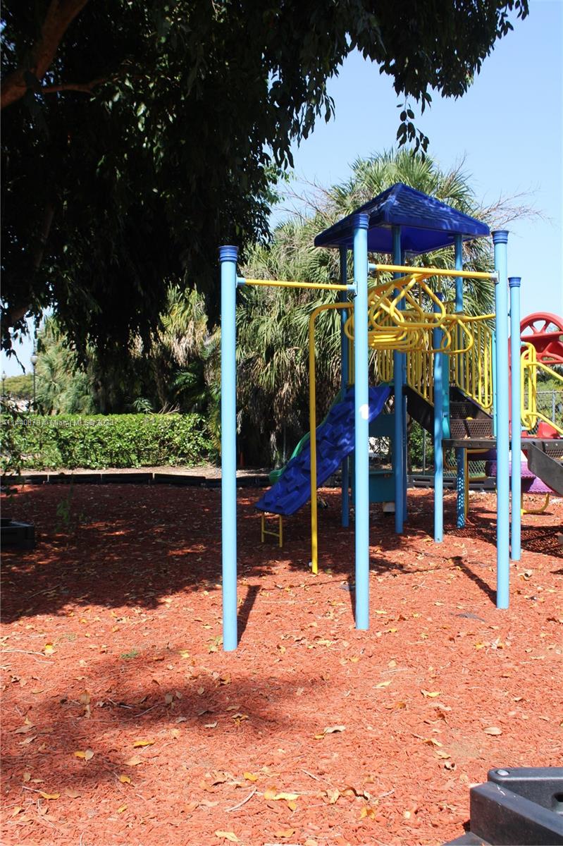3490 Foxcroft Road, Unit B110 Miramar, FL 33025 - Photo 26 of 39 a view of a wooden house with a yard