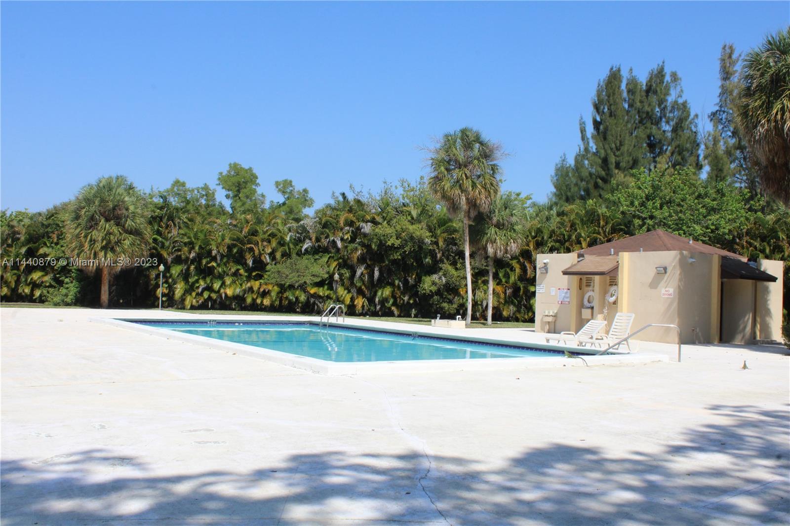 3490 Foxcroft Road, Unit B110 Miramar, FL 33025 - Photo 32 of 39 a view of swimming pool with a yard