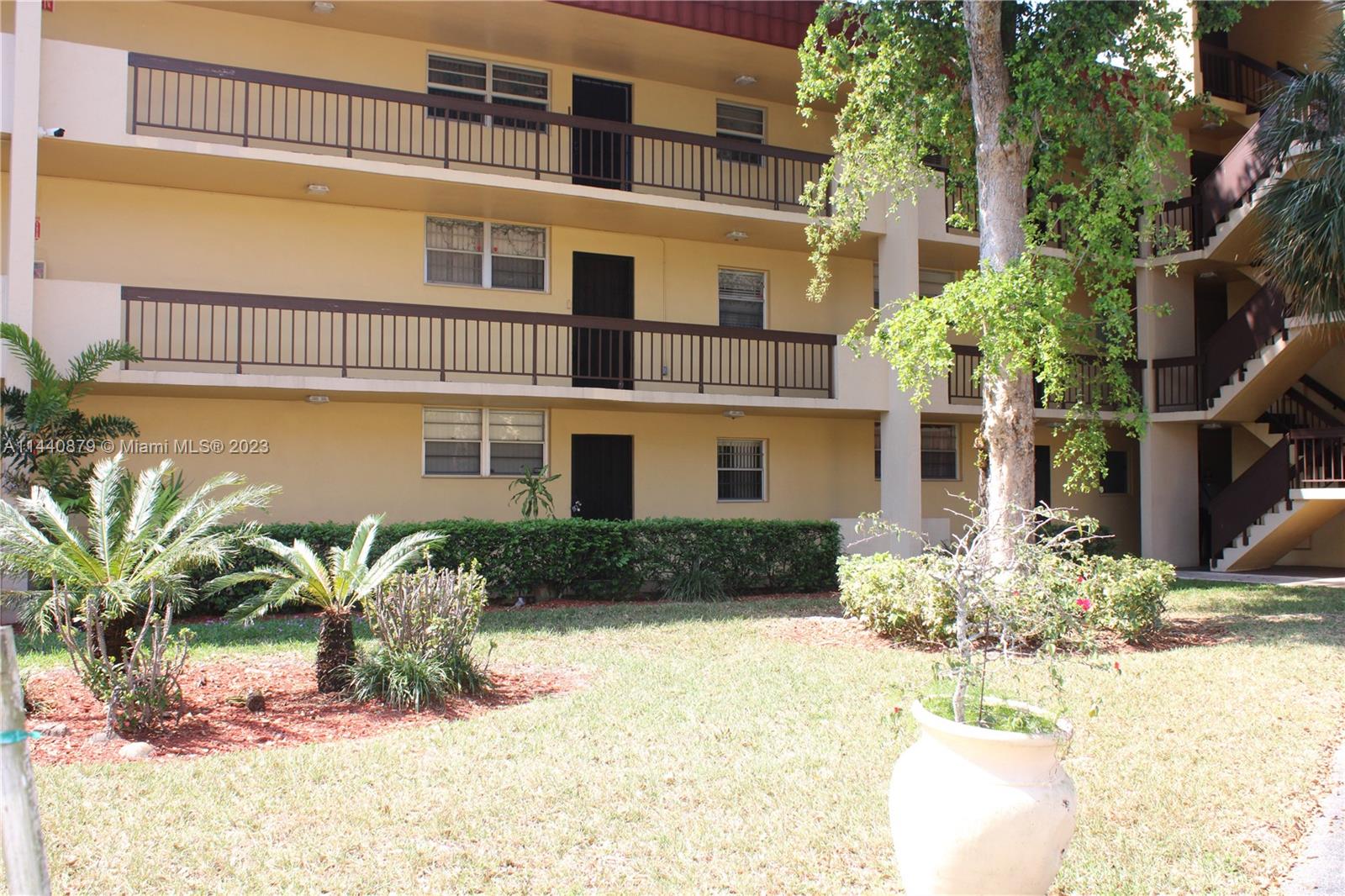 3490 Foxcroft Road, Unit B110 Miramar, FL 33025 - Photo 35 of 39 a front view of a house with a yard