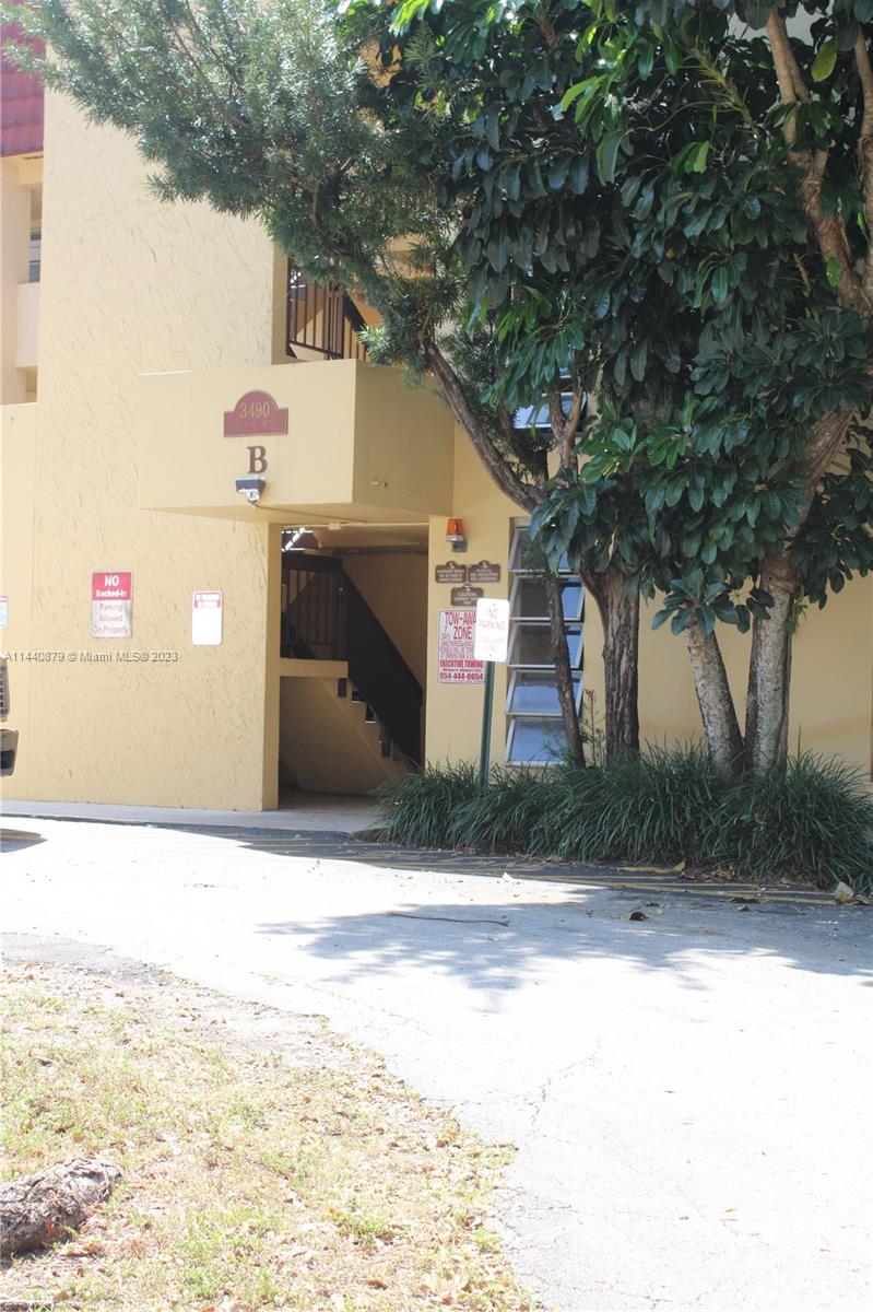 3490 Foxcroft Road, Unit B110 Miramar, FL 33025 - Photo 36 of 39 a front view of a house with a yard