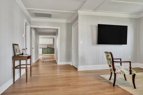 a view of a livingroom with furniture and a flat screen tv