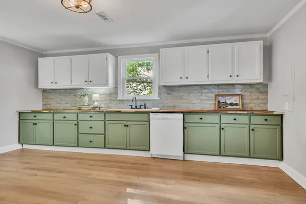 a kitchen with a cabinets window and sink