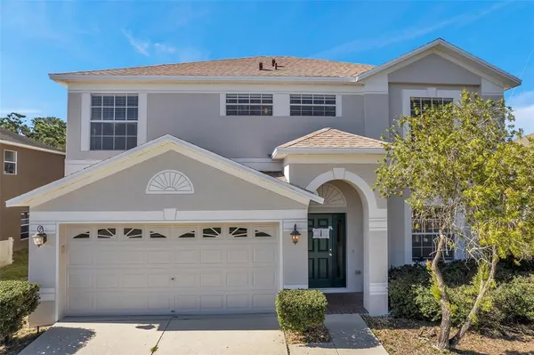 a front view of a house with a garage