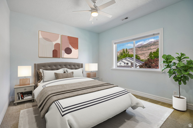 220 East Ridge Road Orem, UT 84057 - Photo 29 of 52 Ceiling fan, window with mountain scenery, carpet flooring, and light blue wall finish