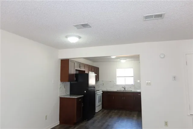 a room with window and flat screen tv