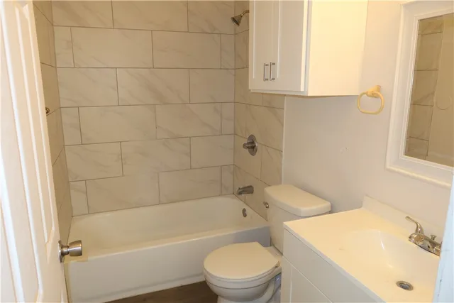 a bathroom with a sink a toilet and a bathtub