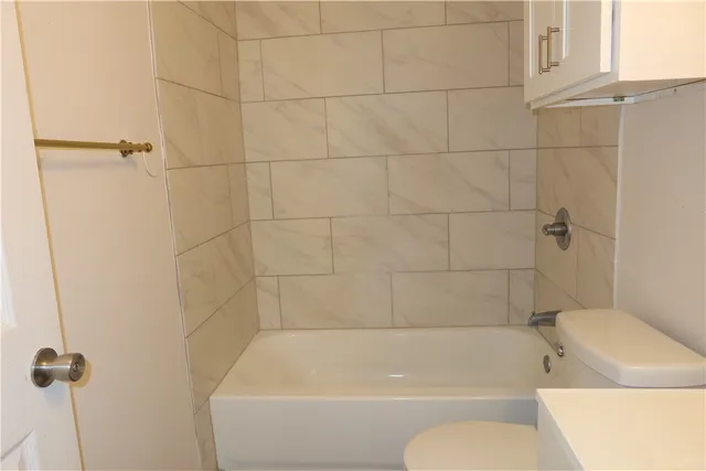 a bathroom with a bath tub