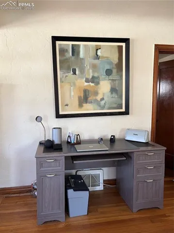 a view of cabinets and wooden floor