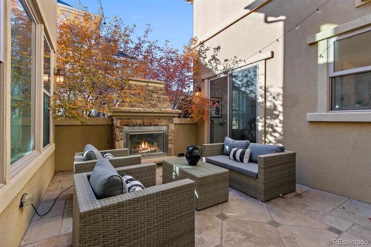 3436 Willow Street Denver, CO 80238 - Photo 11 of 37 a living room with furniture and a fireplace