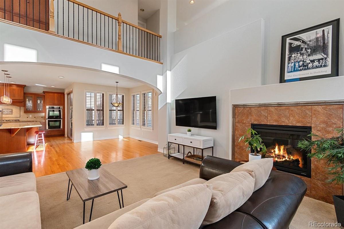 3436 Willow Street Denver, CO 80238 - Photo 12 of 37 a living room with furniture and a flat screen tv