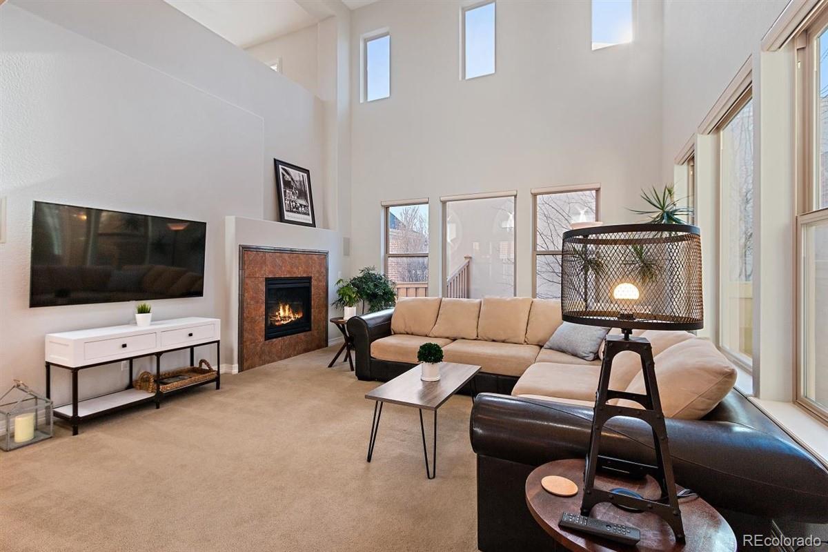 3436 Willow Street Denver, CO 80238 - Photo 13 of 37 a living room with furniture and a flat screen tv