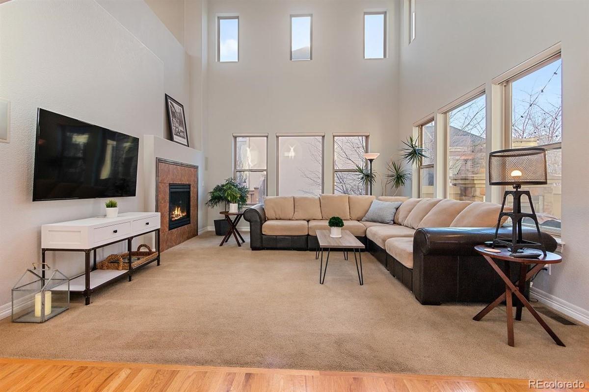 3436 Willow Street Denver, CO 80238 - Photo 14 of 37 a living room with furniture and a flat screen tv