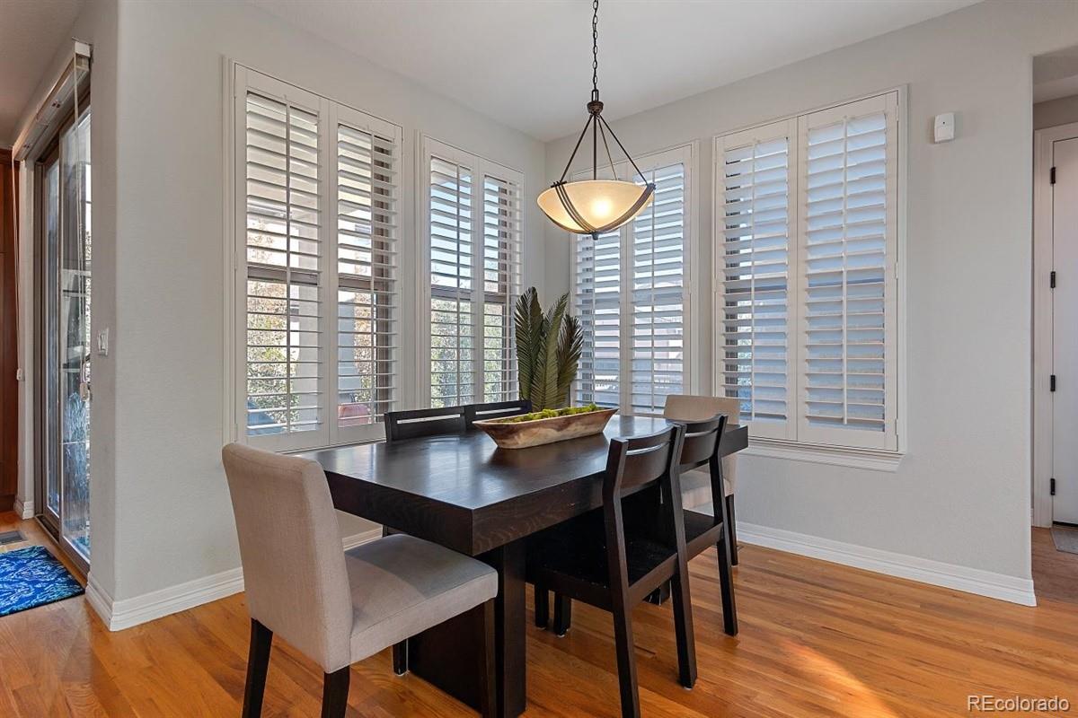 3436 Willow Street Denver, CO 80238 - Photo 17 of 37 a dining room with furniture and window