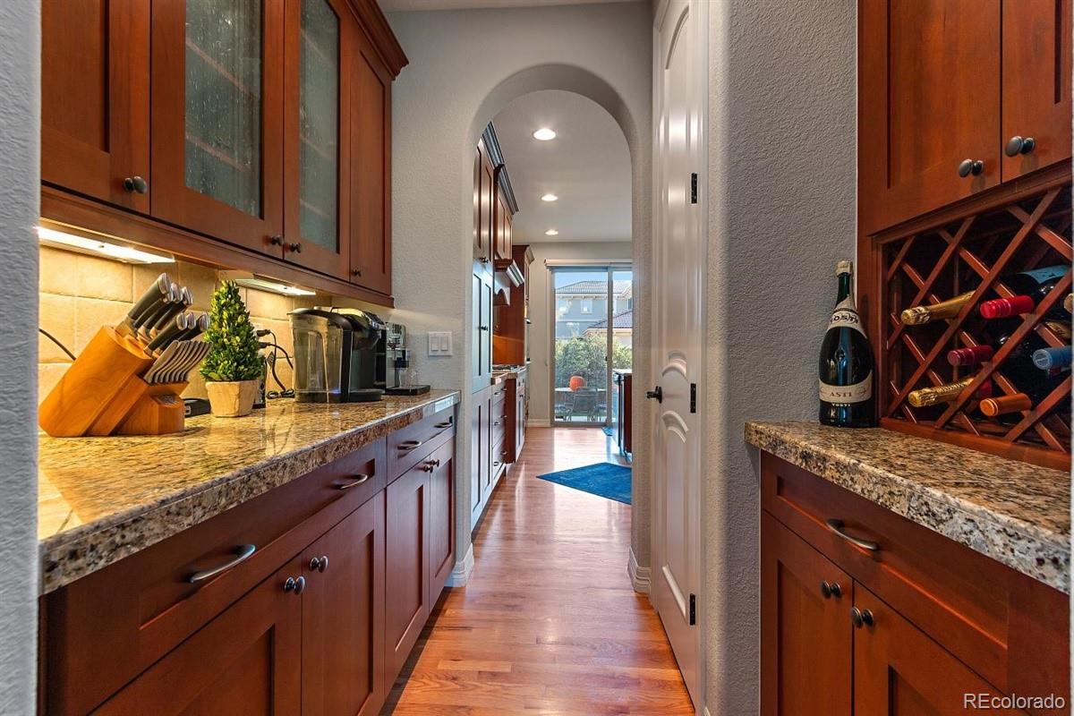 3436 Willow Street Denver, CO 80238 - Photo 2 of 37 a kitchen with stainless steel appliances granite countertop a sink stove and cabinets