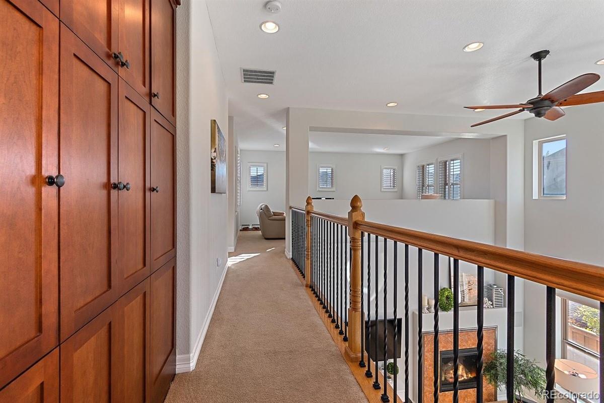 3436 Willow Street Denver, CO 80238 - Photo 24 of 37 a view of a hallway with a mirror and a window