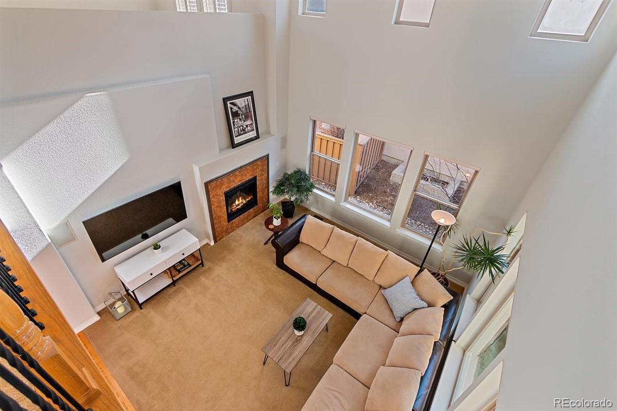 3436 Willow Street Denver, CO 80238 - Photo 26 of 37 a living room with furniture and a flat screen tv