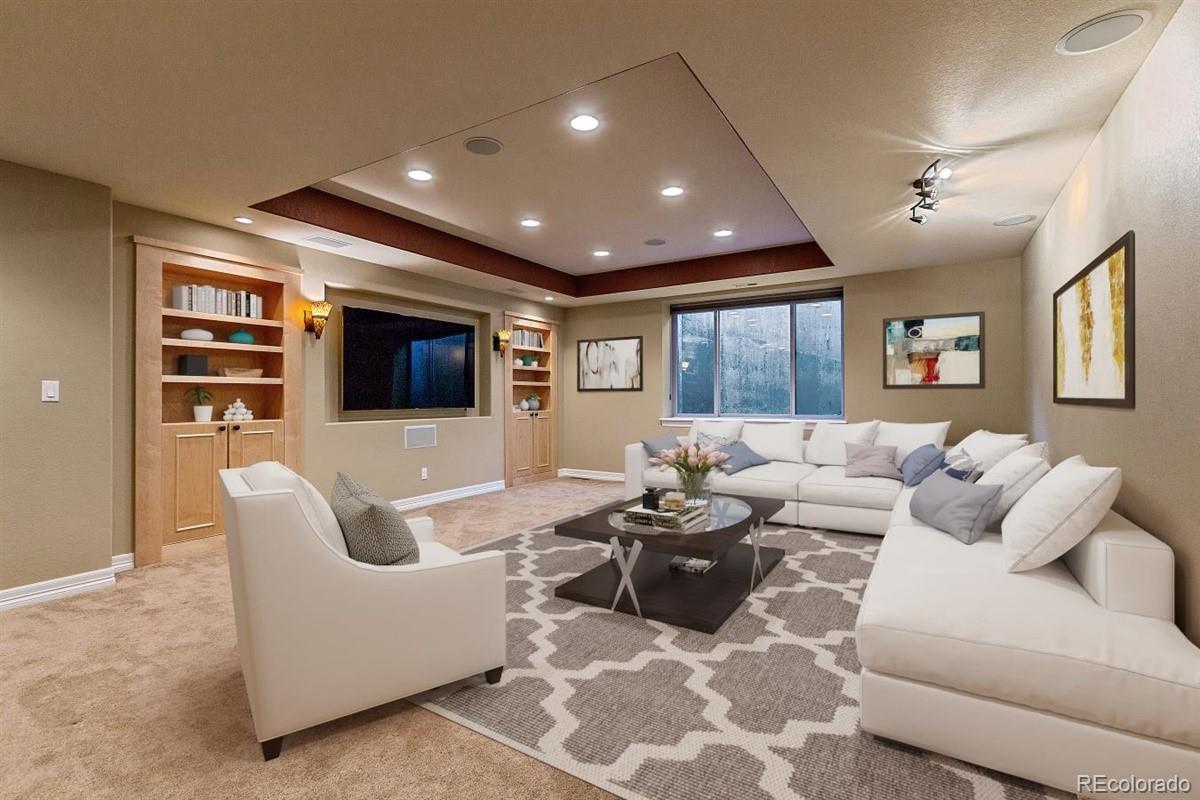 3436 Willow Street Denver, CO 80238 - Photo 27 of 37 a living room with furniture and a flat screen tv