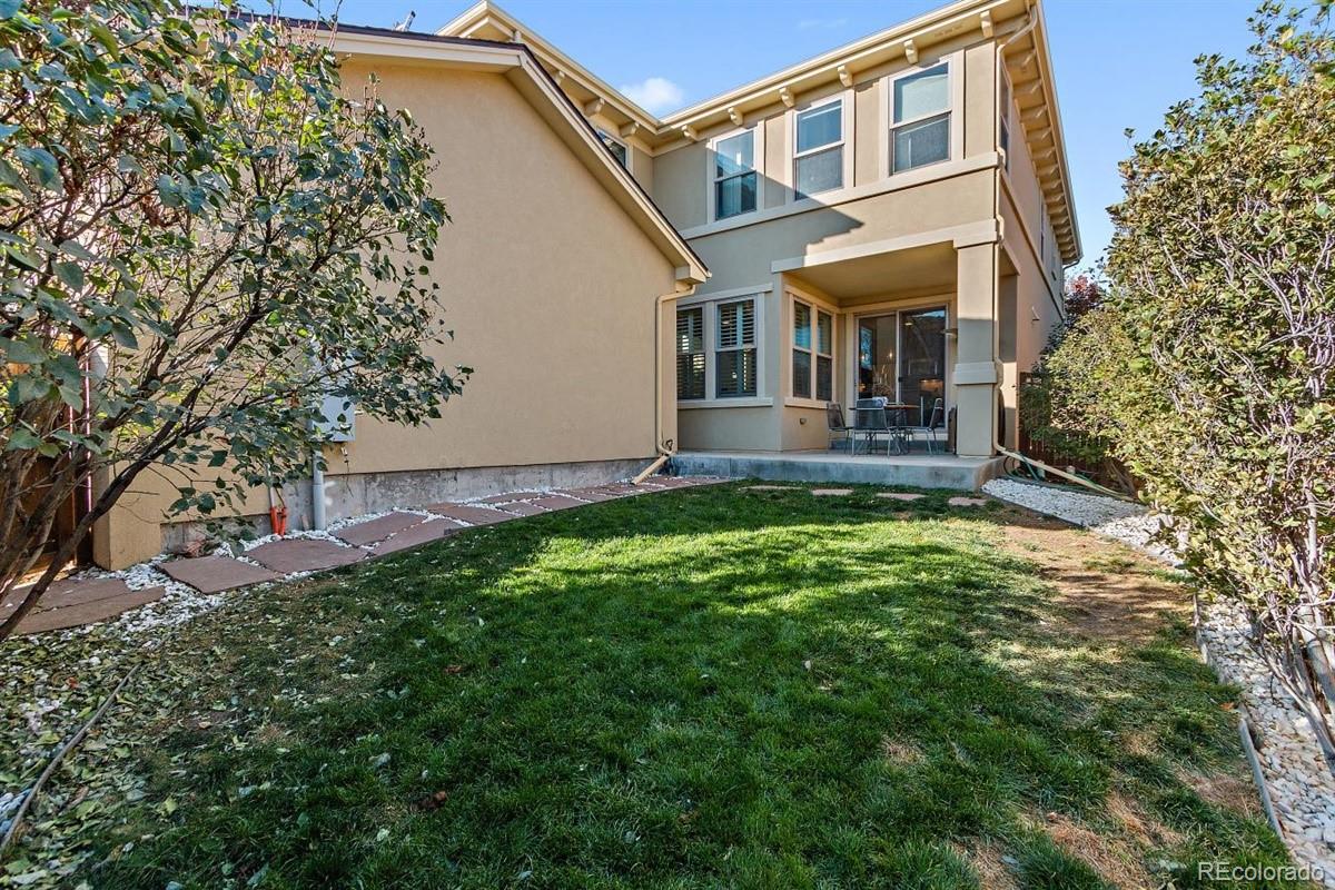 3436 Willow Street Denver, CO 80238 - Photo 33 of 37 a front view of a house with a yard