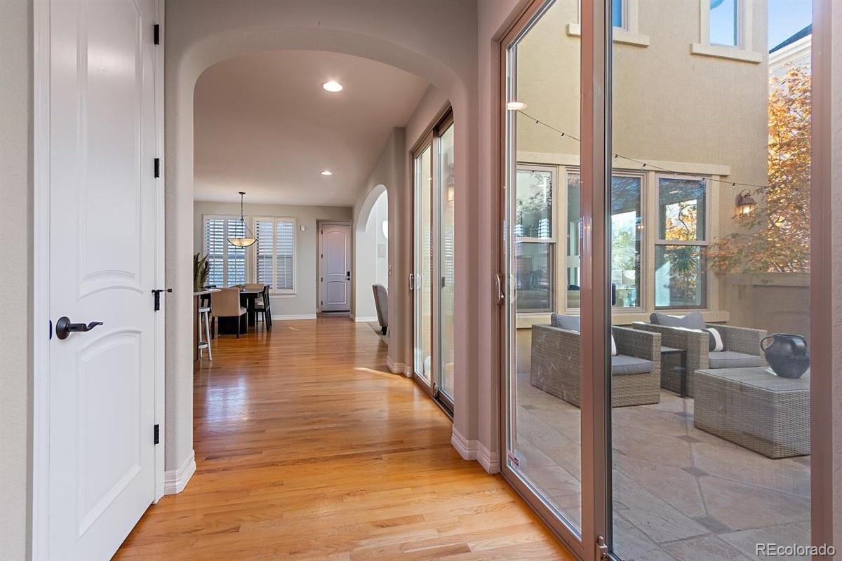 3436 Willow Street Denver, CO 80238 - Photo 9 of 37 a view of a hallway with living room and dining room view