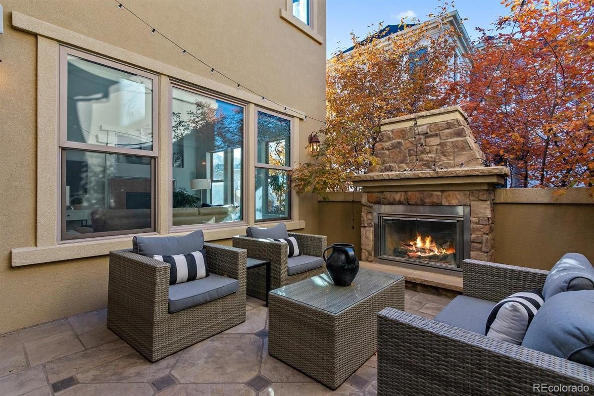 3436 Willow Street Denver, CO 80238 - Photo 10 of 37 a living room with furniture and a fireplace