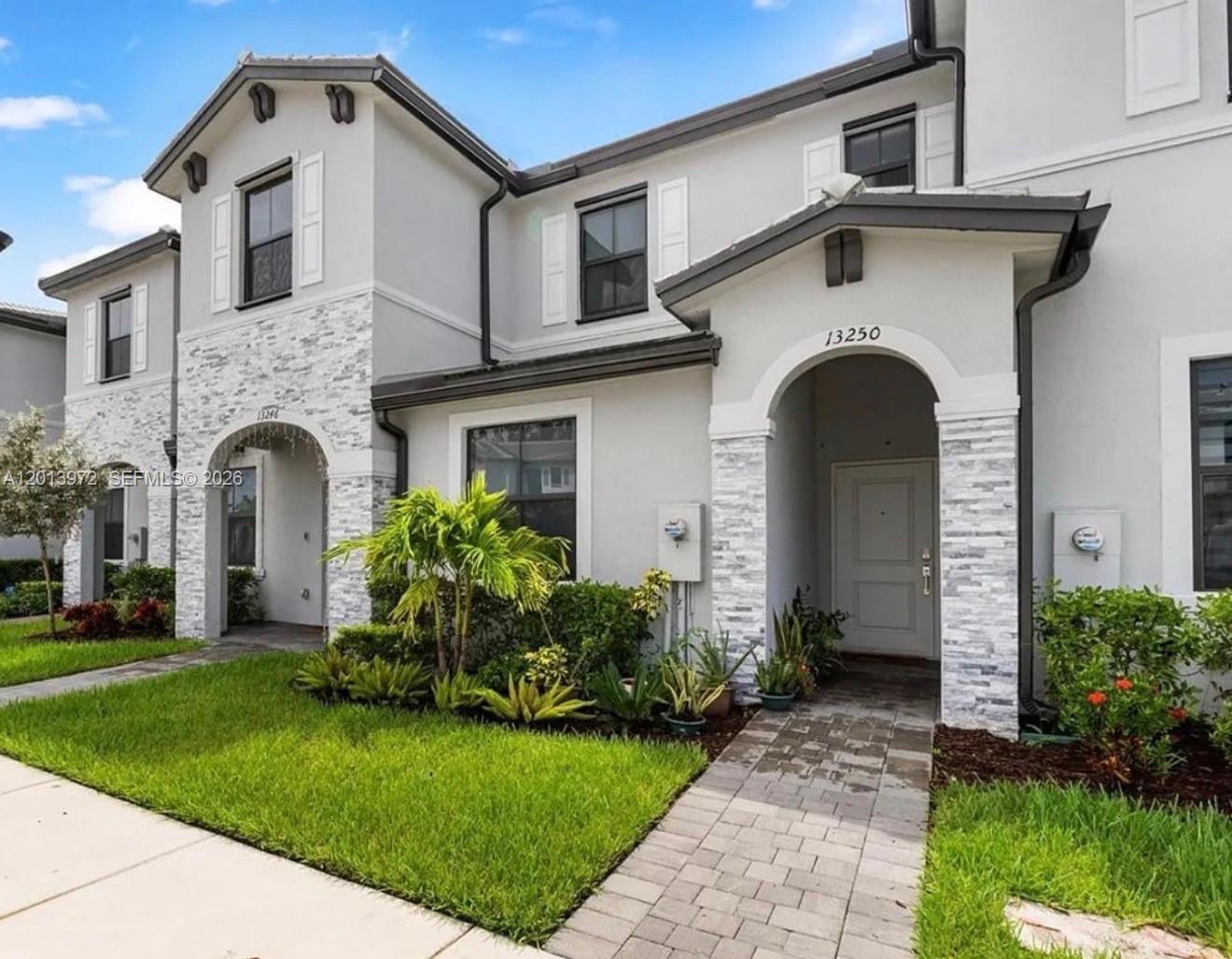 13250 Southwest 285th Street Homestead, FL 33033 - Photo 12 of 13 a front view of a house with garden