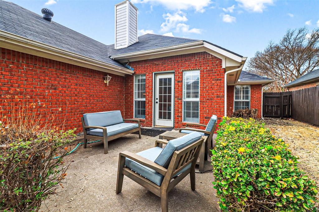 17708 Hillcrest Road Dallas, TX 75252 - Photo 25 of 27 a backyard of a house with outdoor seating