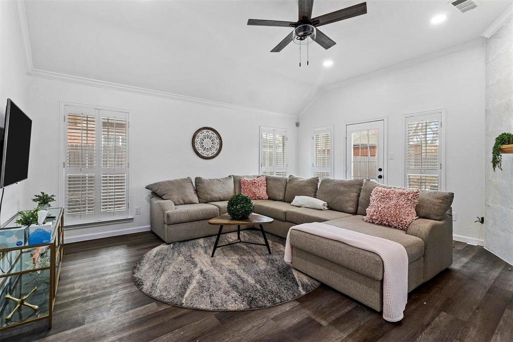 17708 Hillcrest Road Dallas, TX 75252 - Photo 6 of 27 a living room with furniture wooden floor and a flat screen tv