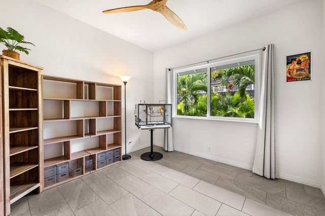 a view of furniture and a large window in a room