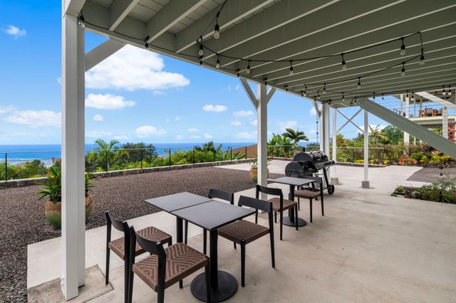 a view of a patio with a table chairs and a patio