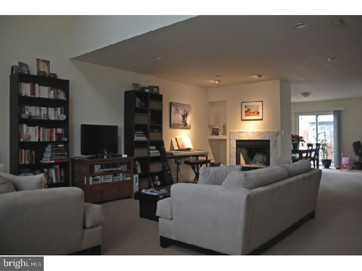 2 Lexington Court Princeton, NJ 08540 - Photo 2 of 7 a living room with furniture a fireplace and a flat screen tv