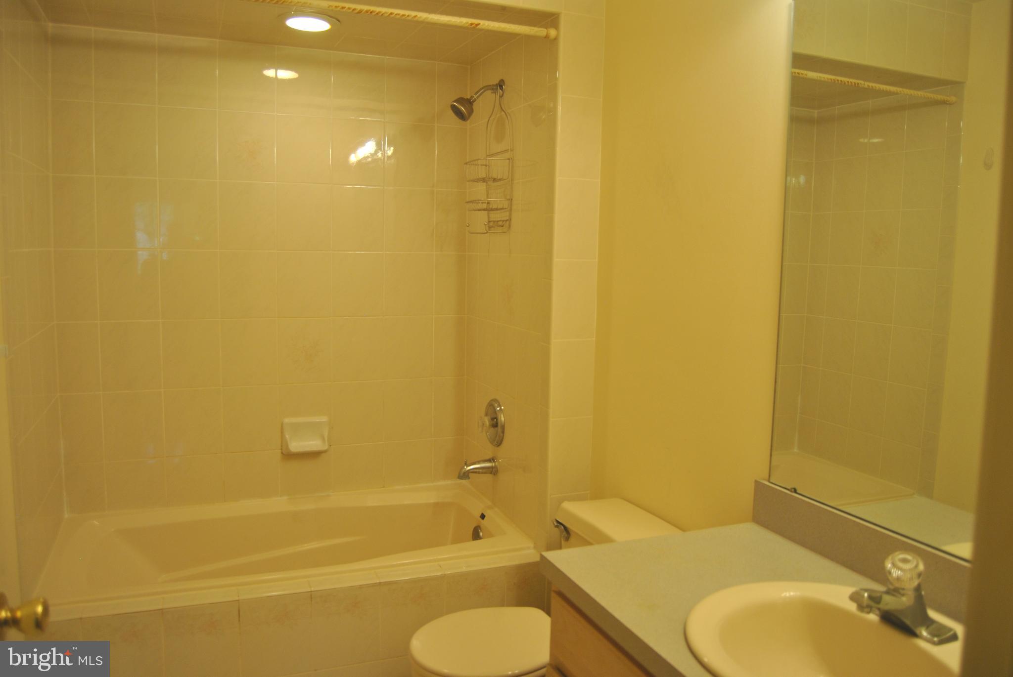2 Lexington Court Princeton, NJ 08540 - Photo 7 of 7 a bathroom with a granite countertop sink and a mirror