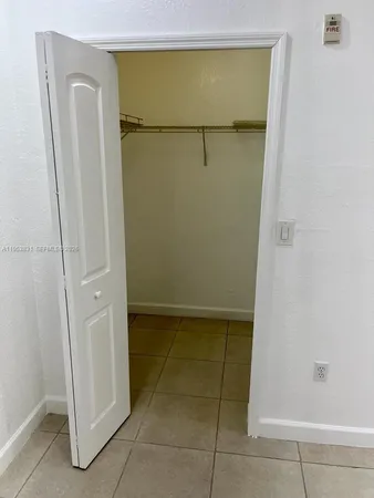 a bathroom with a glass door shower and a sink
