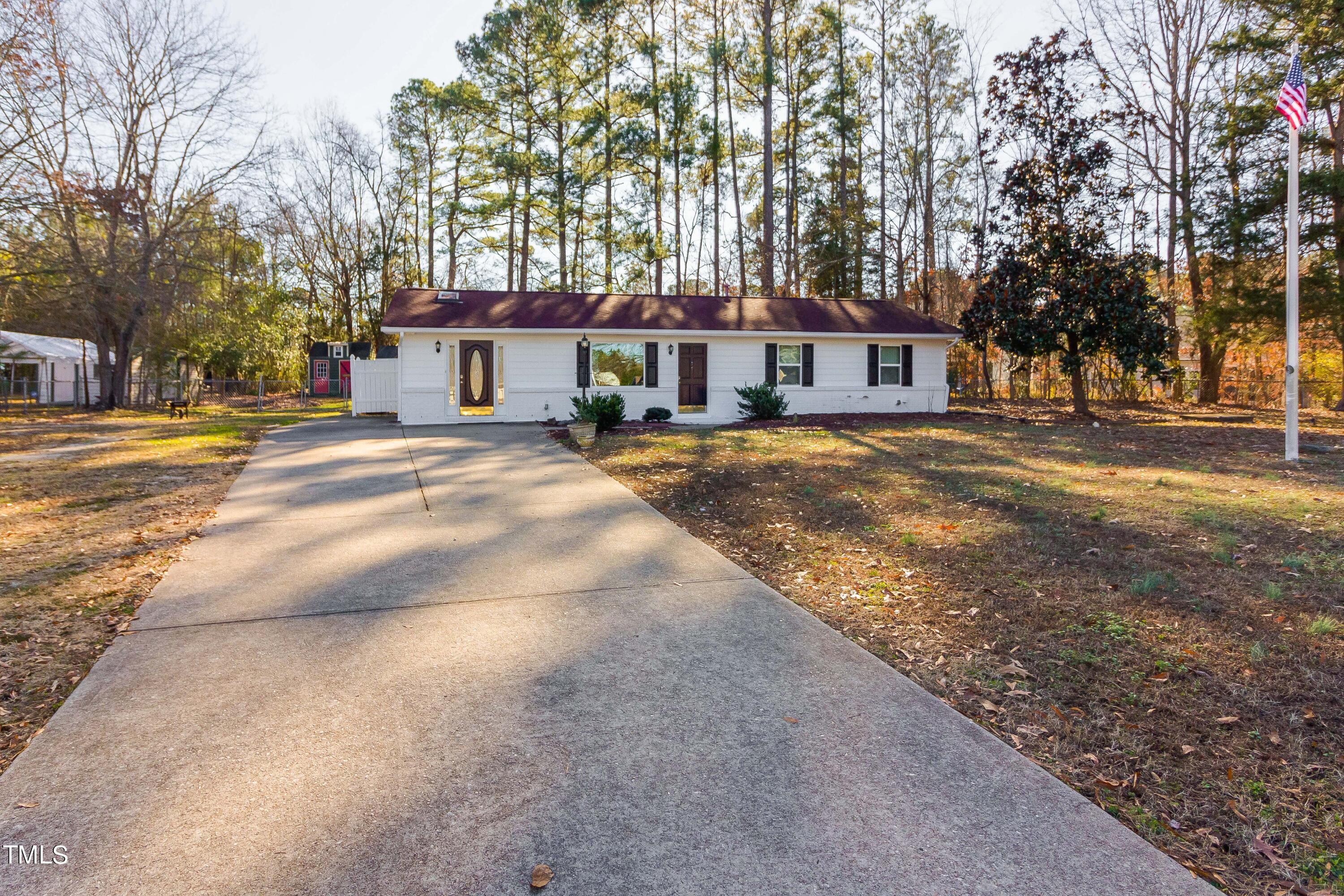 1617 Cameron Drive Wake Forest, NC 27587 - Photo 2 of 21 a front view of a house with a yard and large trees