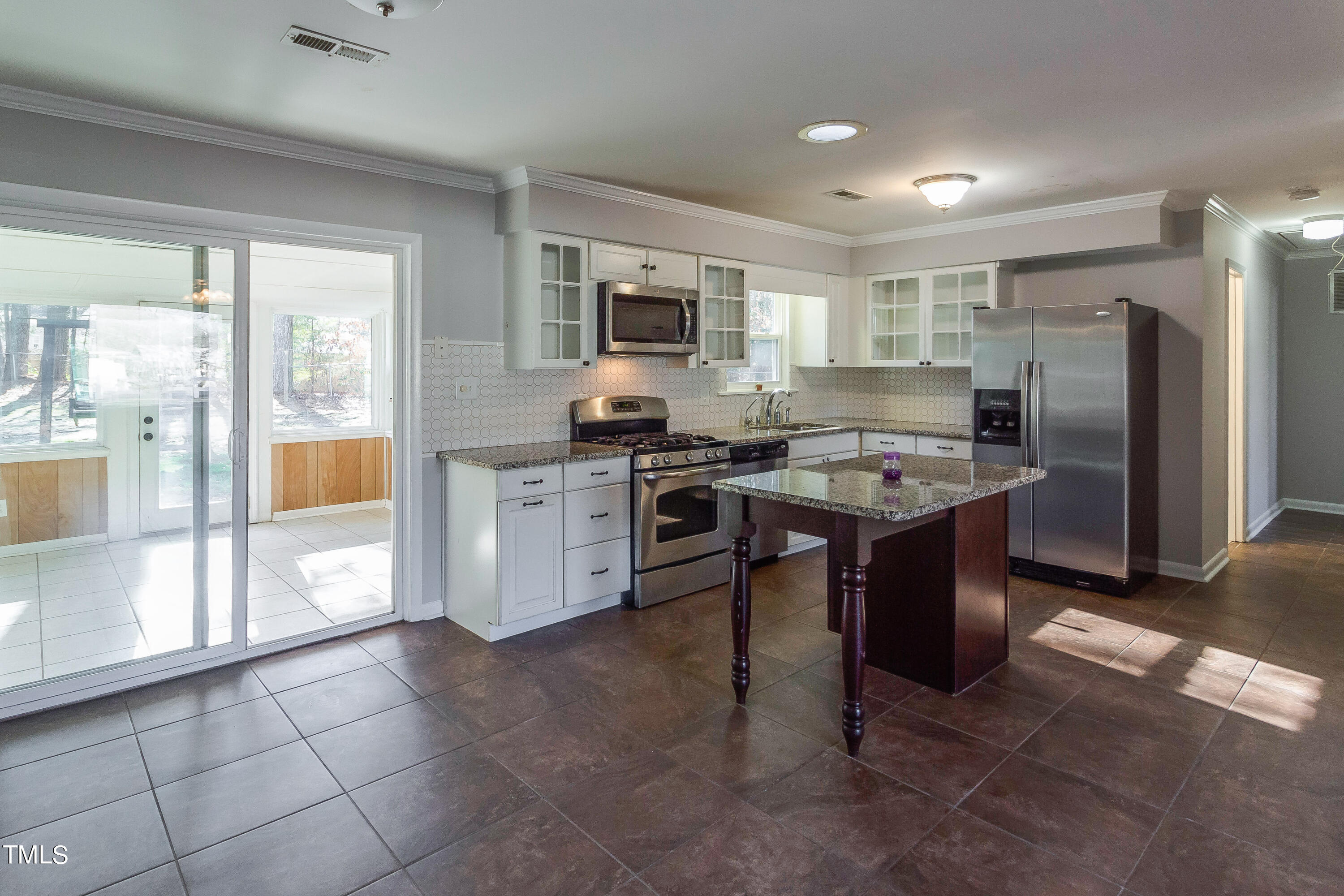 1617 Cameron Drive Wake Forest, NC 27587 - Photo 3 of 21 a large kitchen with stainless steel appliances granite countertop a stove oven and a refrigerator
