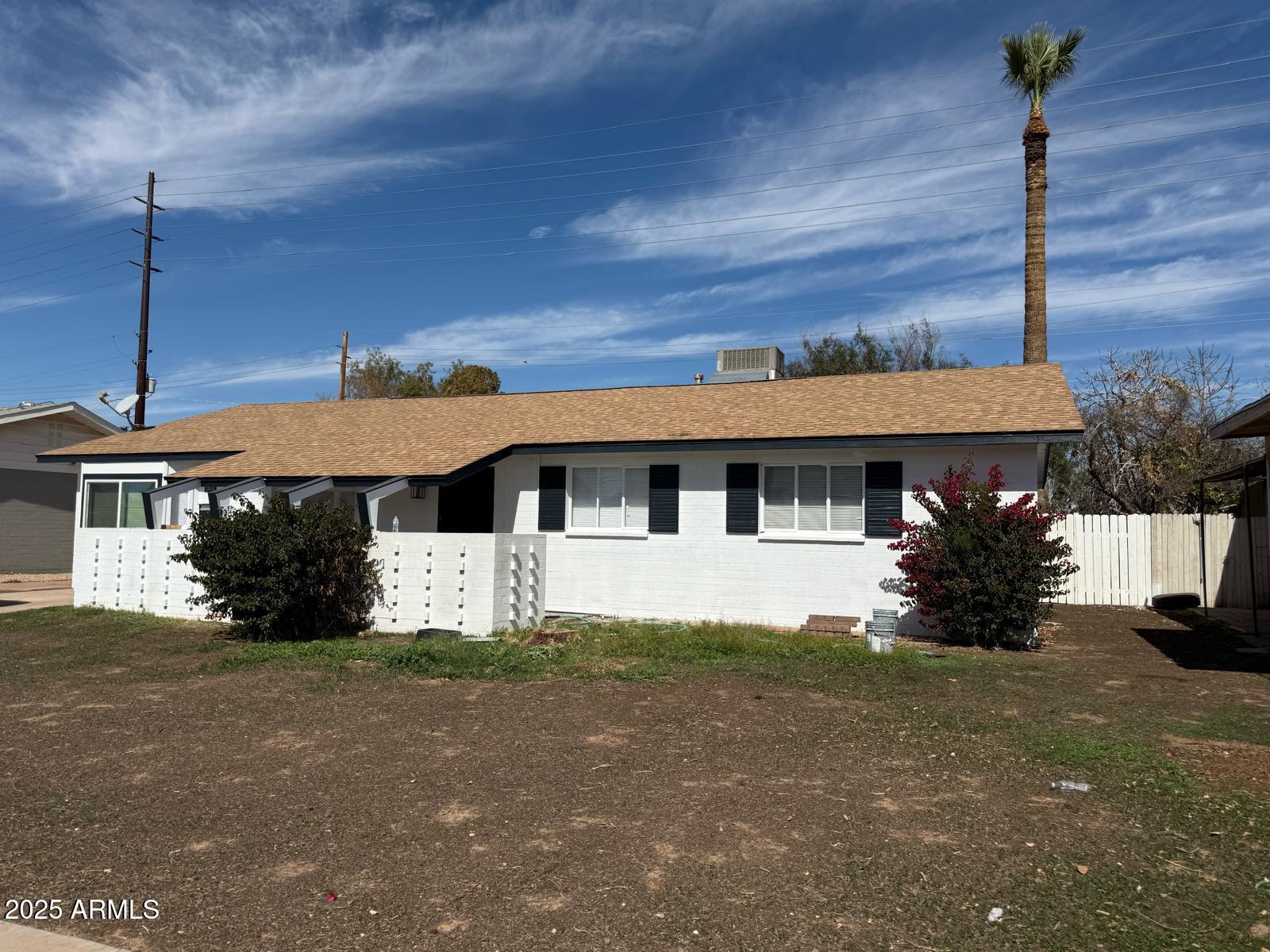 5000 West Osborn Road Phoenix, AZ 85031 - Photo 3 of 23 a front view of a house with a yard
