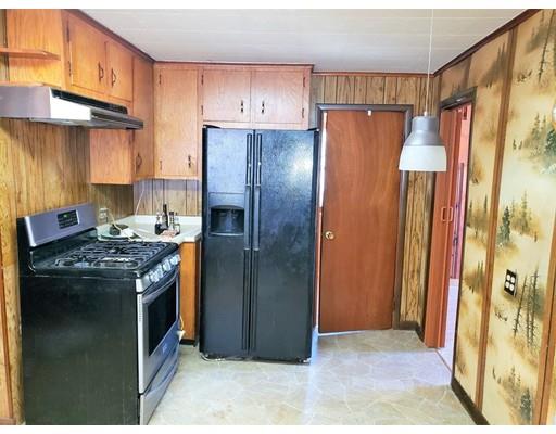 59 Cudworth Road Webster, MA 01570 - Photo 7 of 12 a kitchen with stainless steel appliances granite countertop a refrigerator and a stove