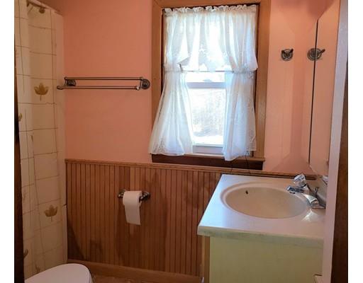 59 Cudworth Road Webster, MA 01570 - Photo 10 of 12 a bathroom with a sink a window and shower