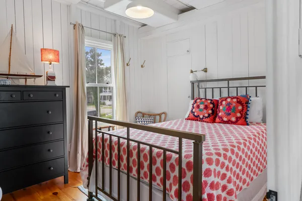 a bedroom with a bed and a dresser