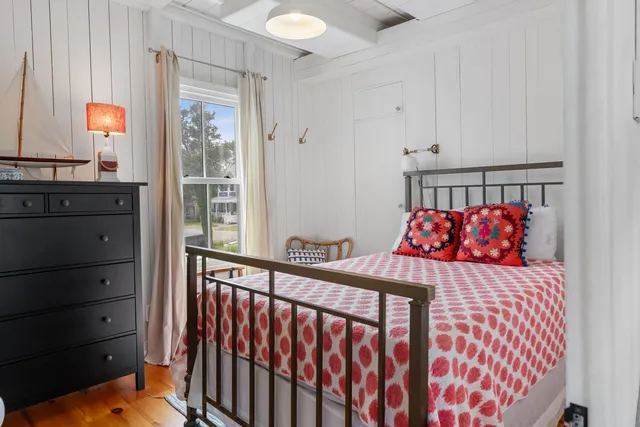 a bedroom with a bed and a dresser