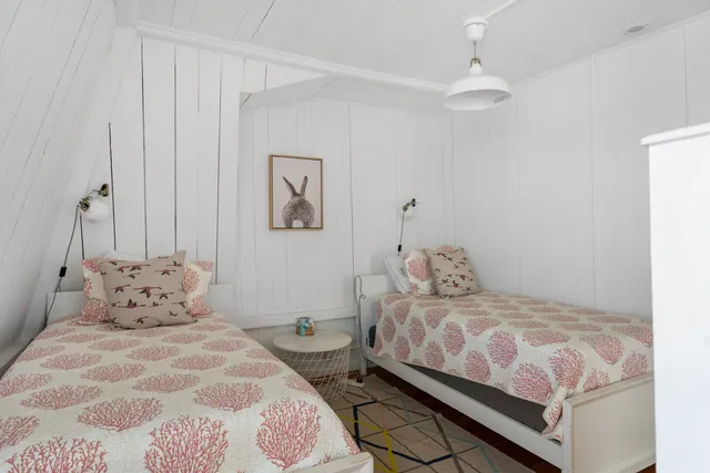 a bedroom with a bed and a table