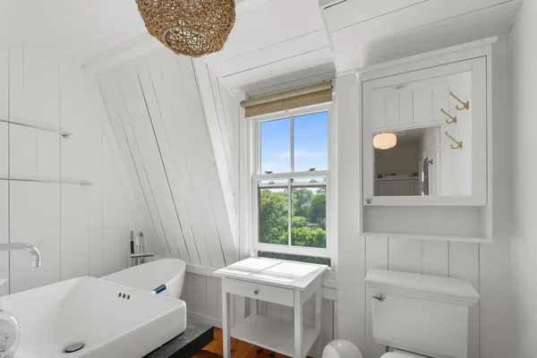 a bathroom with a sink a toilet and a bathtub