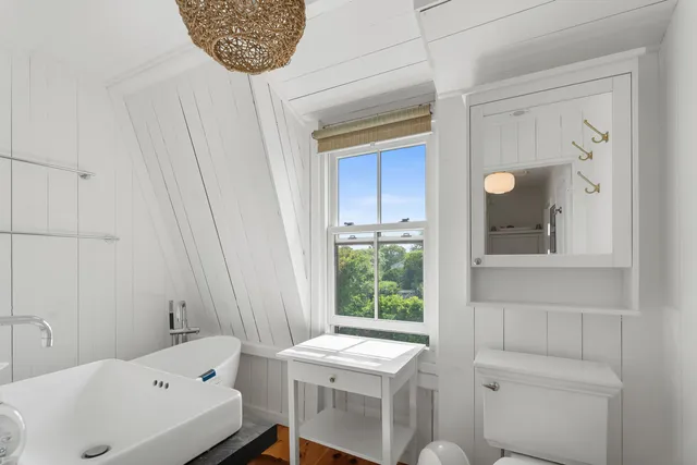 a bathroom with a sink a toilet and a bathtub