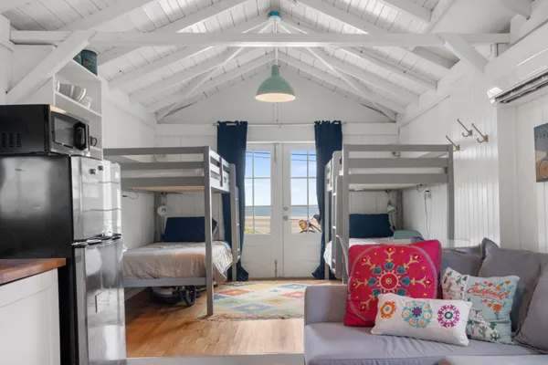 a bedroom with furniture and a chandelier